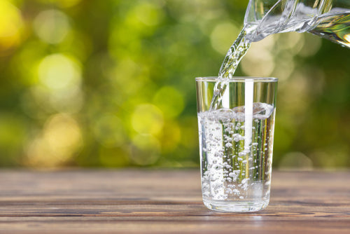 water pouring into a glass