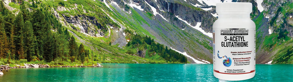 bottle of glutathione against background of a mountain lake